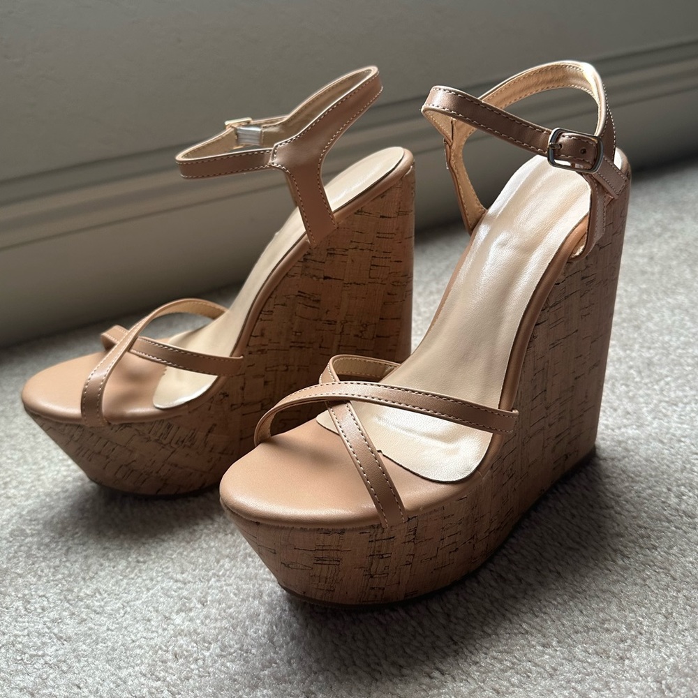 6.5 size nude wedges that fit more like a 7. Never worn, brand new still in box!